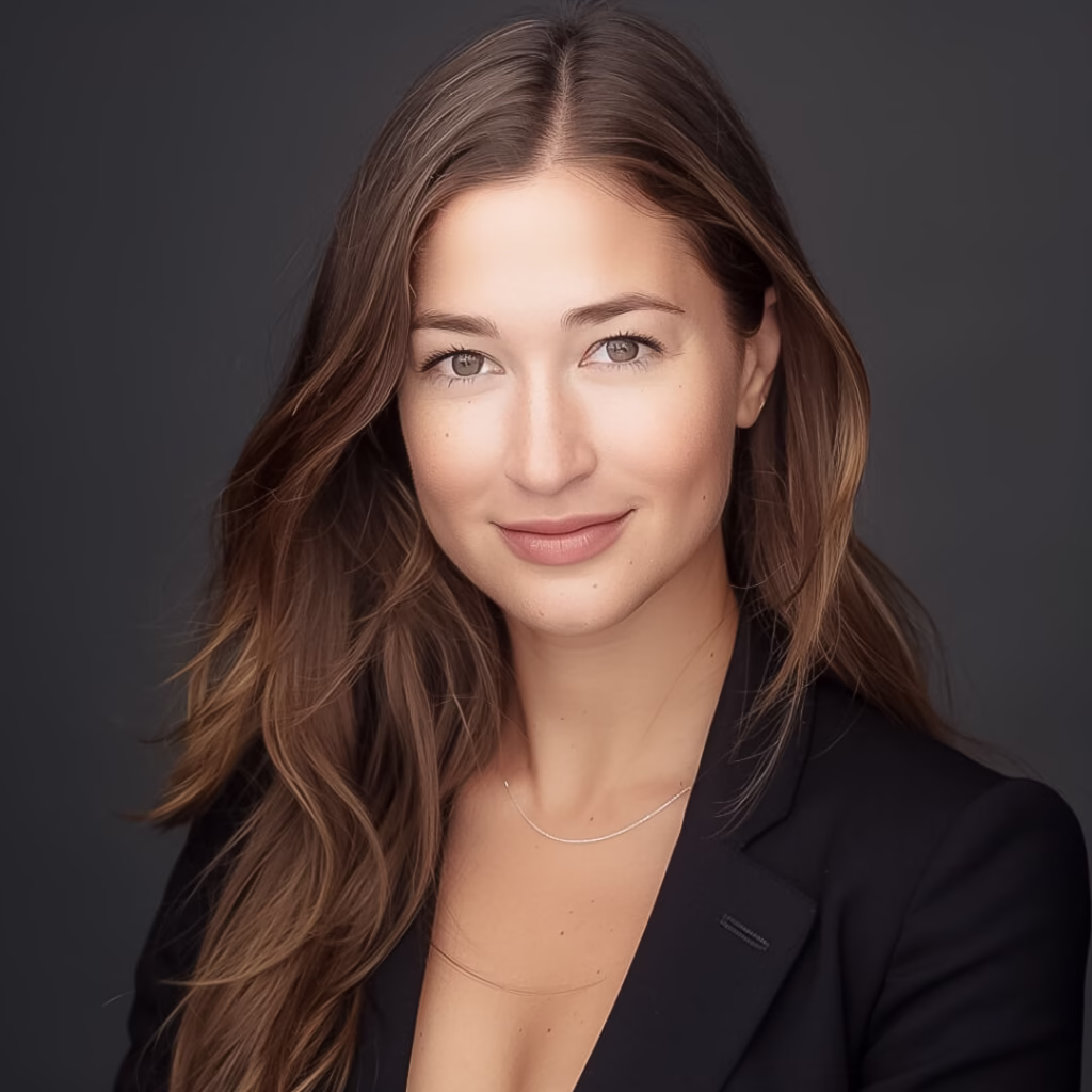 Professional studio headshot of a woman with long hair and a dark background, taken in Teaneck NJ