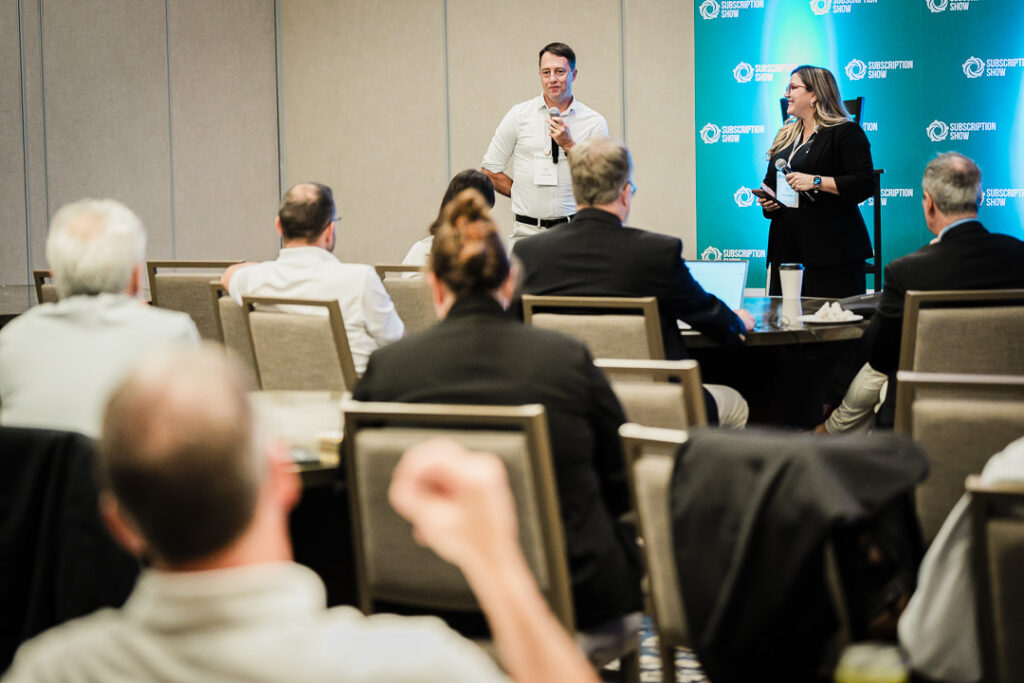 speaker-presenting-research-and-data-onstage-by-alex-kaplan-photography