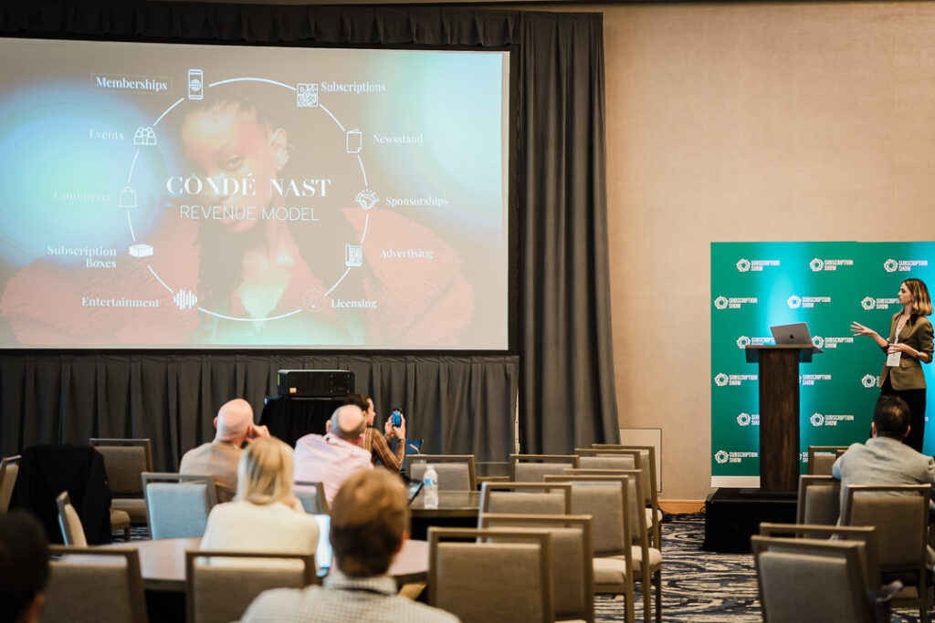 conference-audience-watching-presentation-on-main-stage-by-alex-kaplan-photography
