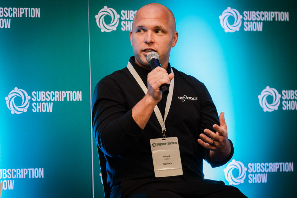 panelist-speaking-onstage-at-subscription-show-event-by-alex-kaplan-photography