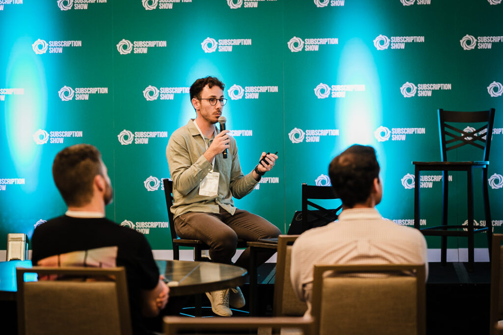 02-speaker-presenting-onstage-during-business-conference-by-alex-kaplan-photography
