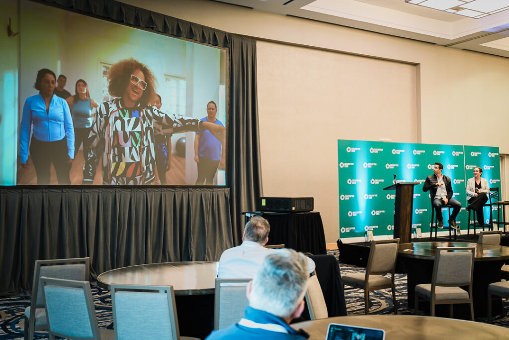 virtual-panel-session-on-screen-during-conference-event-by-alex-kaplan-photography
