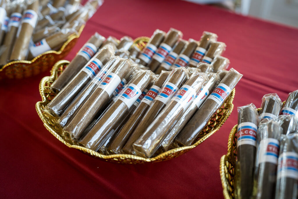 Branded Tilcon cigars displayed in golden baskets at client appreciation event