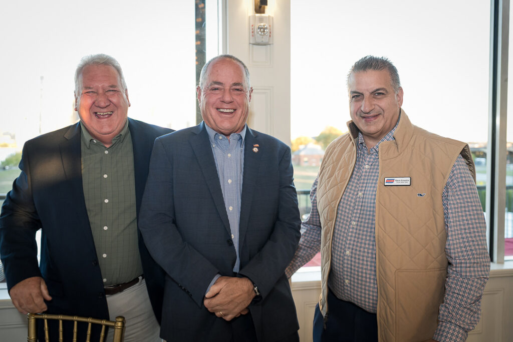 Three executives standing together at Tilcon client appreciation day in Liberty State Park venue
