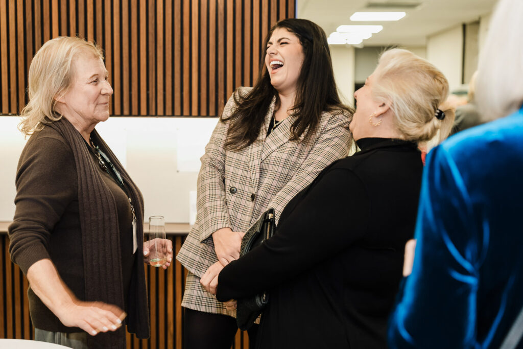 Candid moment of laughter at Helen Keller National Center Walters-Smithdas Legacy Atrium dedication