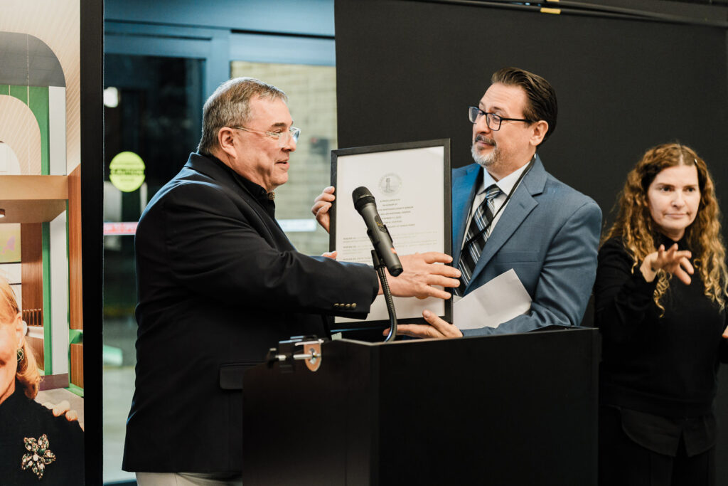 Certificate presentation honoring Barbara Walters and Dr. Robert J. Smithdas at Helen Keller National Center dedication