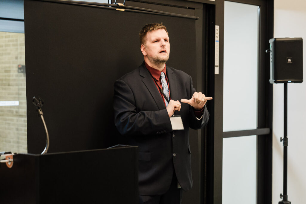 Community advocate presenting during Helen Keller National Center dedication ceremony Long Island