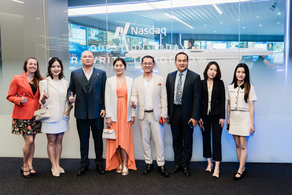 Group photo at Nasdaq MarketSite lobby with “Question Today, Rewrite Tomorrow” backdrop