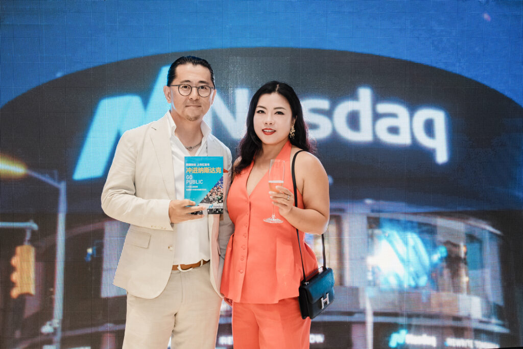 Linkhome AI executives celebrating Nasdaq IPO with GO PUBLIC item corporate photography Times Square