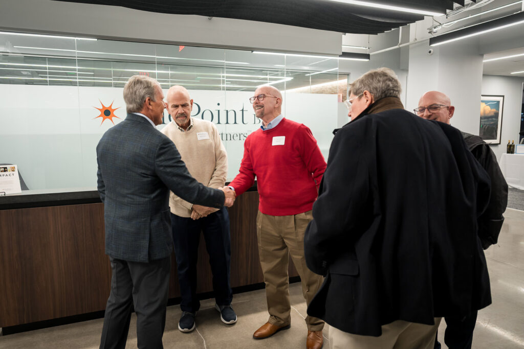 OnePoint BFG Wealth Partners clients networking during wine tasting event at Parsippany NJ office