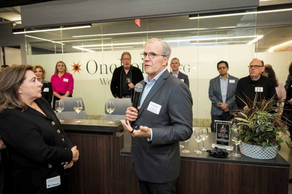 OnePoint BFG executive giving welcome speech at Parsippany NJ wine tasting event
