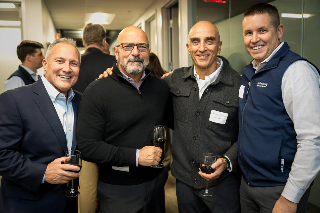 Wine professional with guests at OnePoint BFG educational tasting event