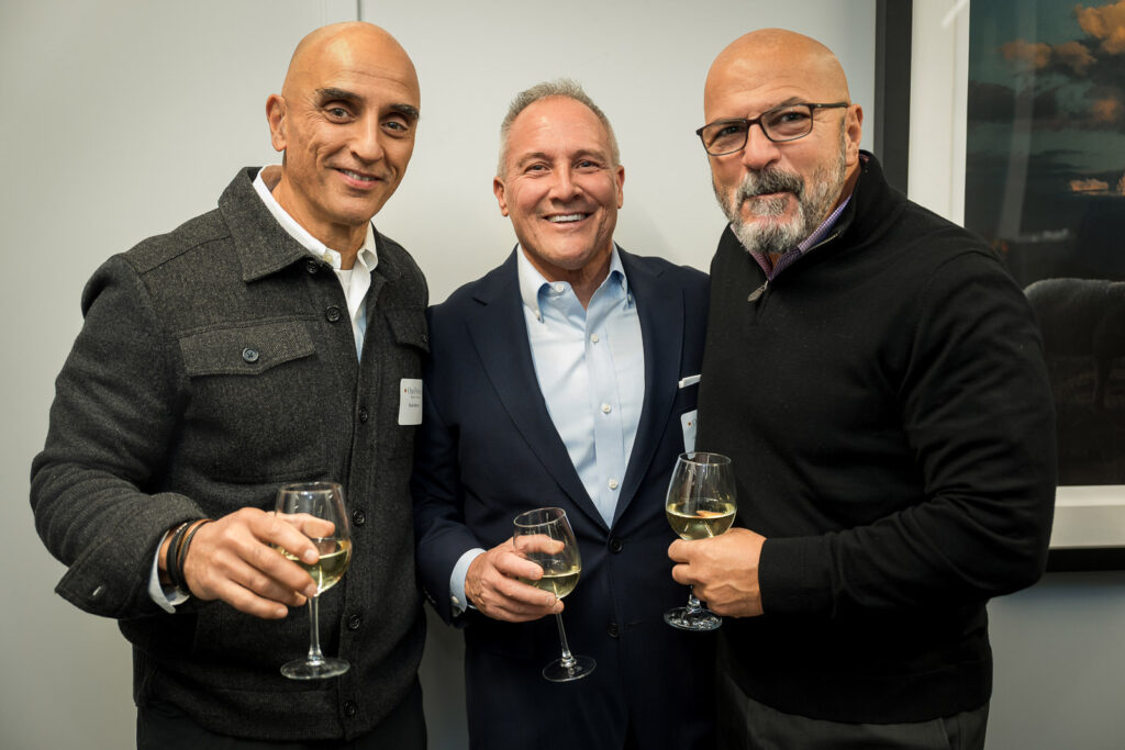 Male professionals networking over wine at Parsippany corporate event