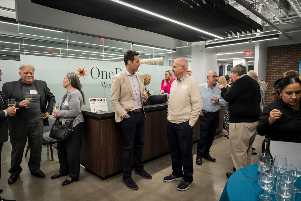 Guest examining wine at New Jersey wealth management event