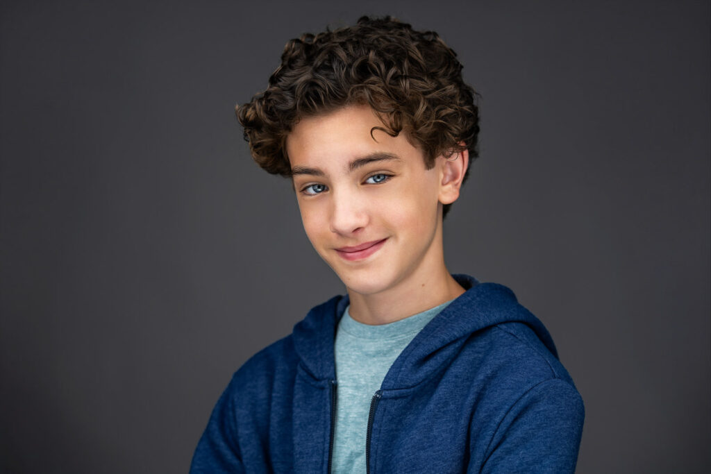 Professional actor headshot of Ridgewood's Maximo Masefield in casual blue hoodie by Alex Kaplan Photography