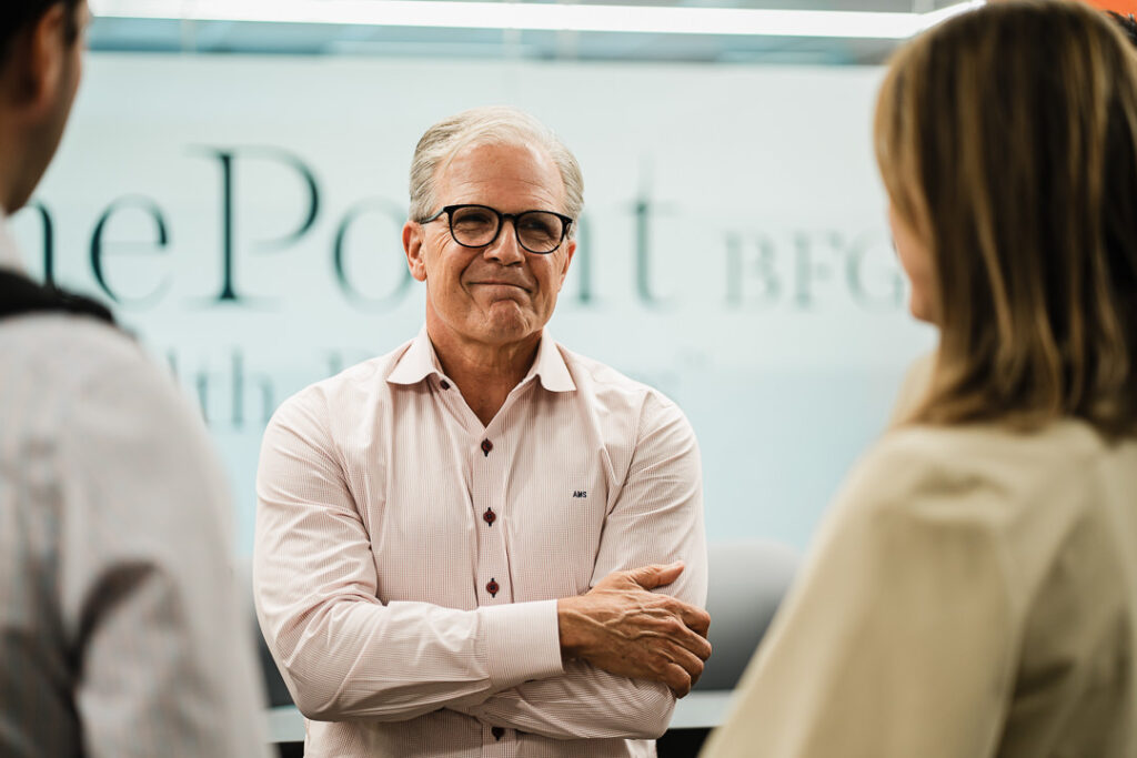 OnePoint financial advisor engaging with guests during brand launch event