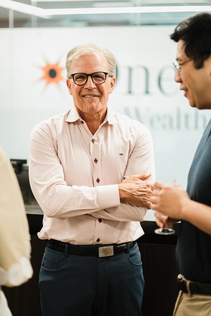 OnePoint advisor in genuine moment during brand launch celebration