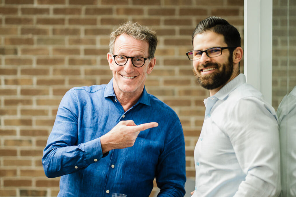 Engaging conversation between OnePoint advisors during celebration