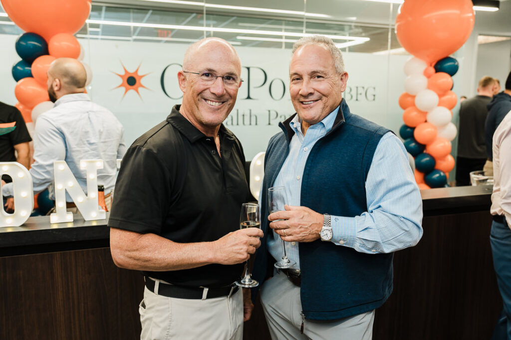 Happy team members celebrating successful brand launch at OnePoint