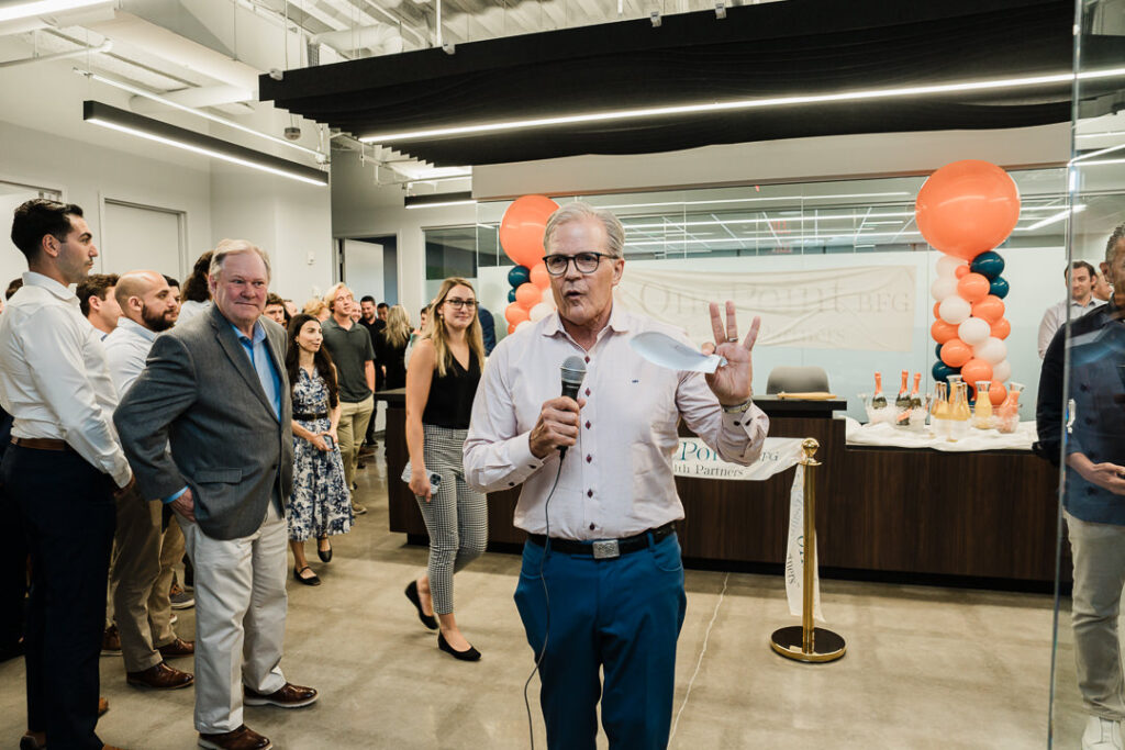 OnePoint wealth advisor speaking to guests at brand launch celebration in Parsippany NJ