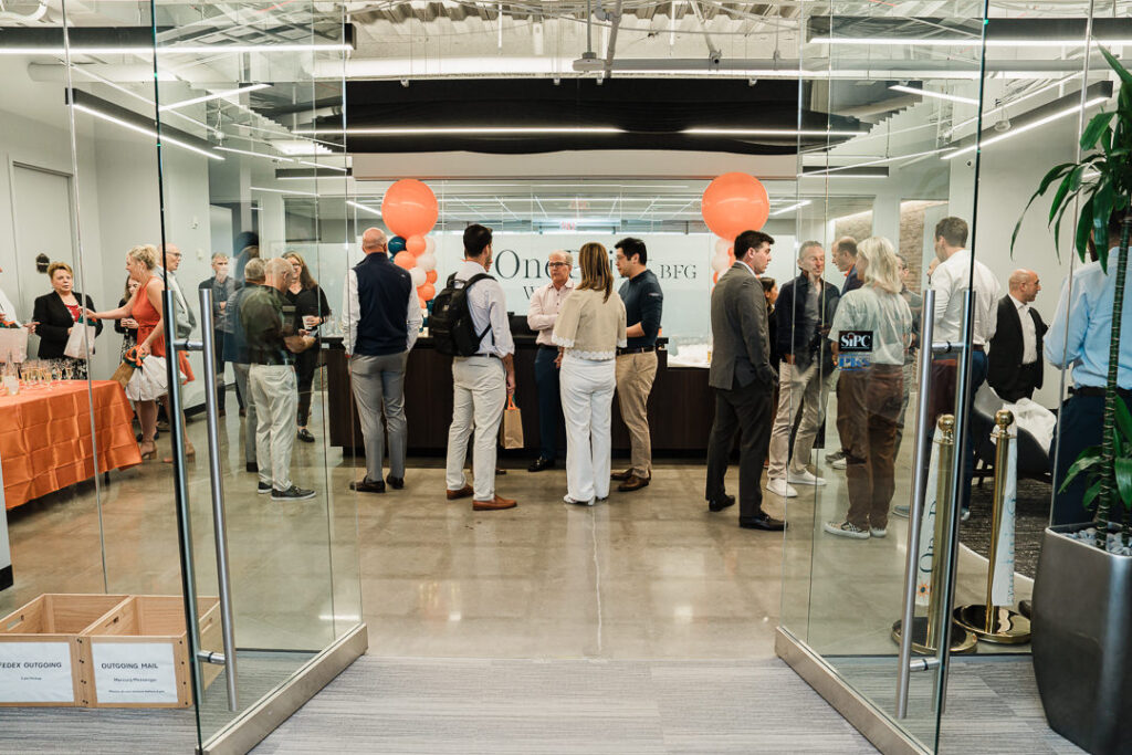 Guests networking at OnePoint BFG Wealth Partners modern office space during brand launch in Parsippany New Jersey