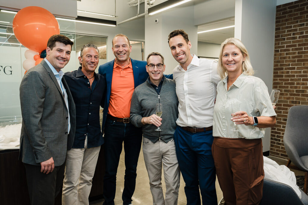 OnePoint BFG partners and advisors celebrating brand launch together
