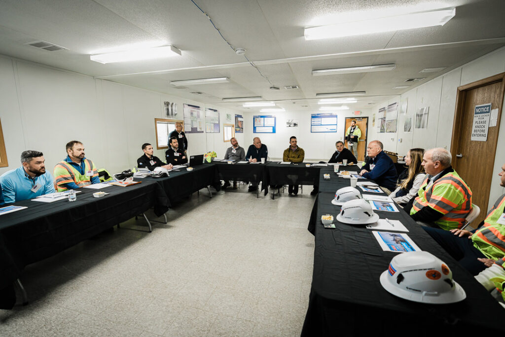 Wide view of Tilcon conference room meeting with team members at tables during CEO visit to Clinton Point Quarry