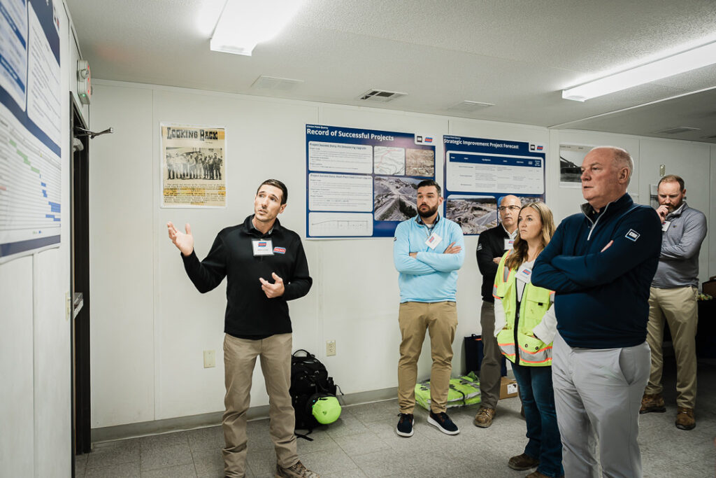 Tilcon executive in business attire presenting to seated group at Clinton Point Quarry CEO visit