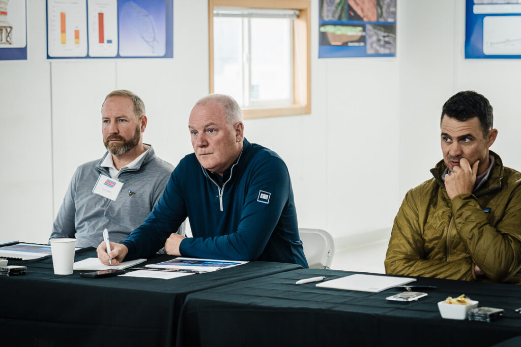 Three Tilcon executives seated and listening attentively during Clinton Point Quarry presentation