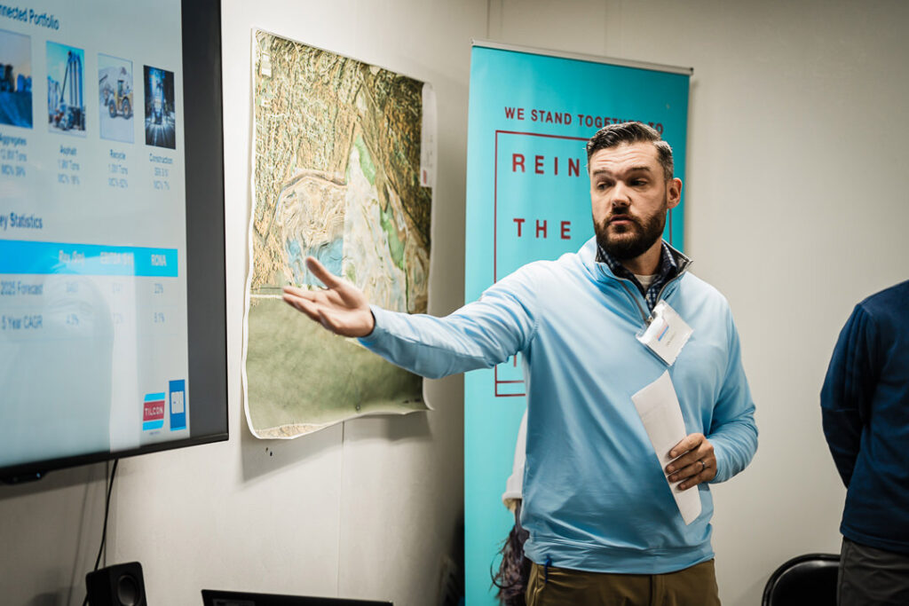 Tilcon project manager presenting geological and project information on screen during CEO visit