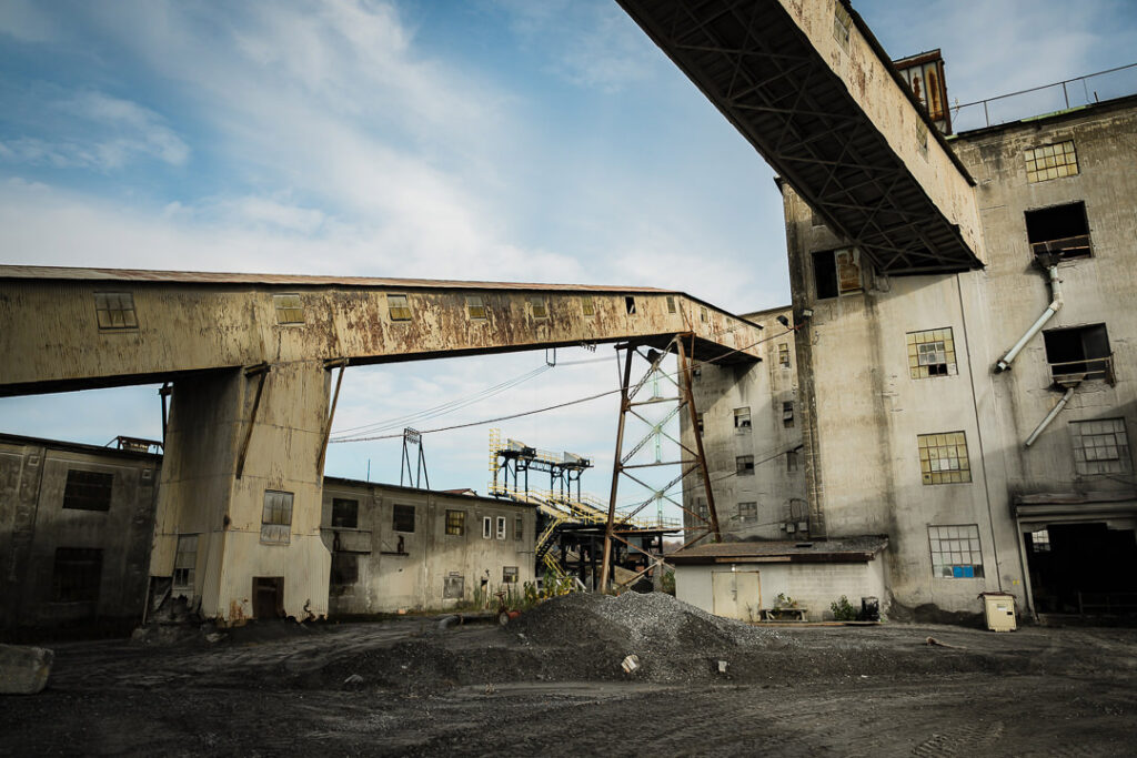 Wide view of Clinton Point Quarry industrial processing complex showing multiple buildings and conveyor systems