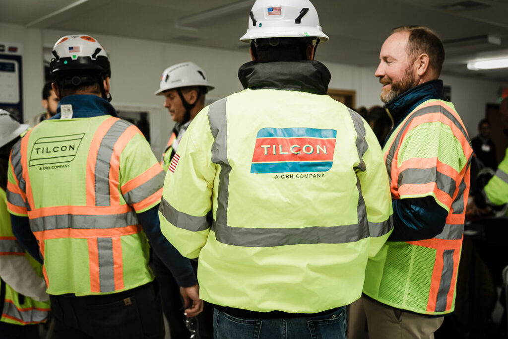 Close up of Tilcon branded safety vests and hard hats with American flag decals at Clinton Point Quarry
