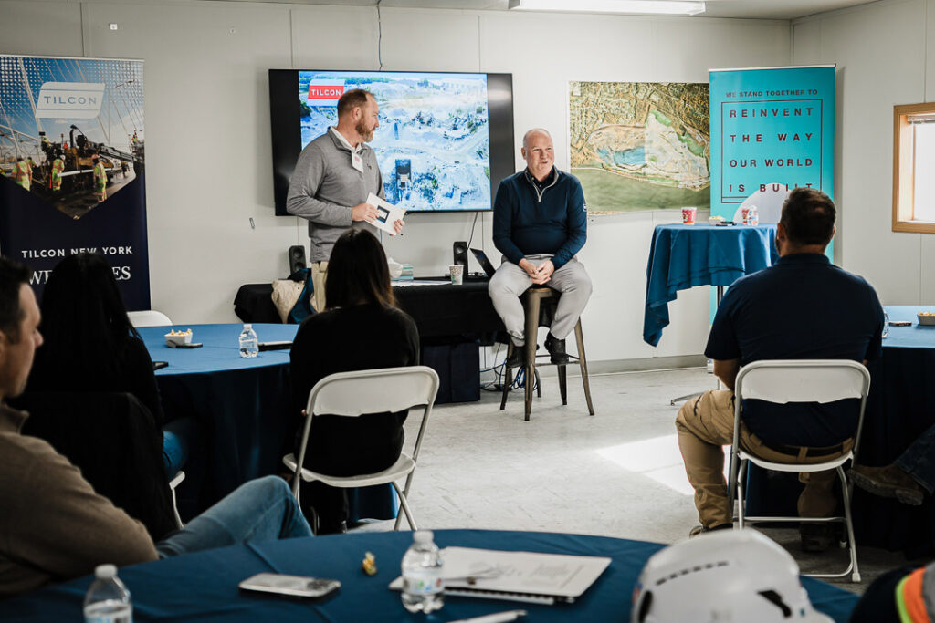 Town hall style Q&A session with Tilcon executives on stools and team members seated facing them at Clinton Point Quarry