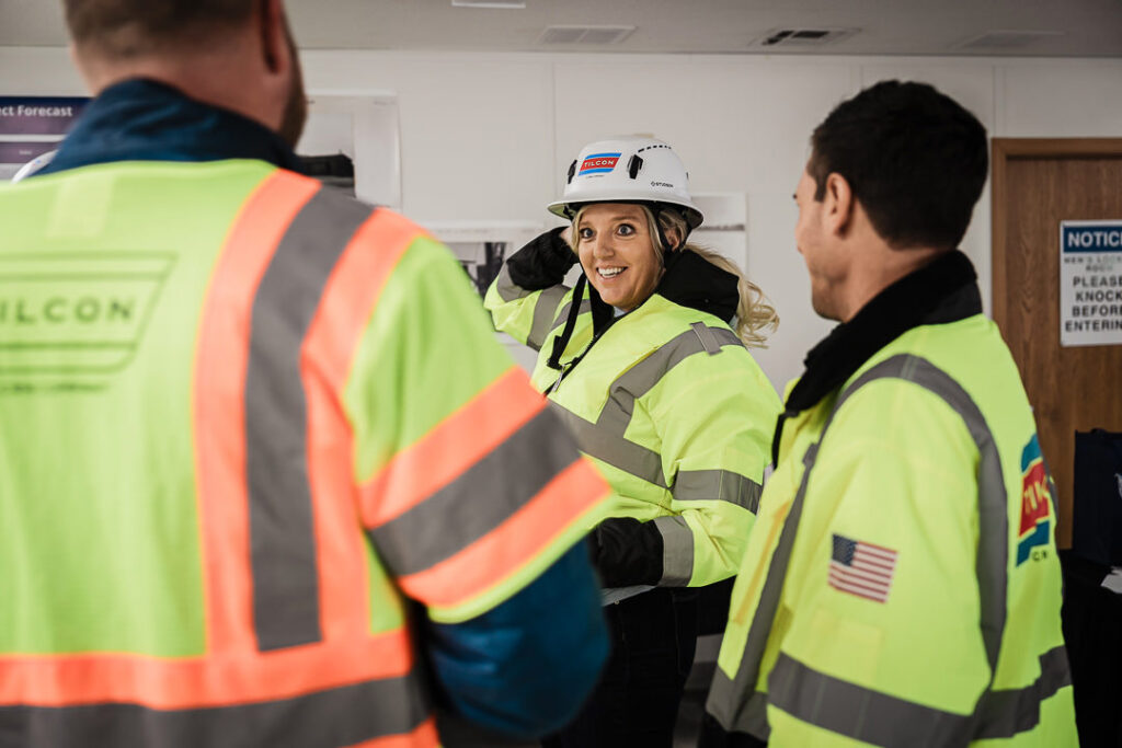 Tilcon team member woman in safety vest and hard hat smiling during Clinton Point Quarry site tour