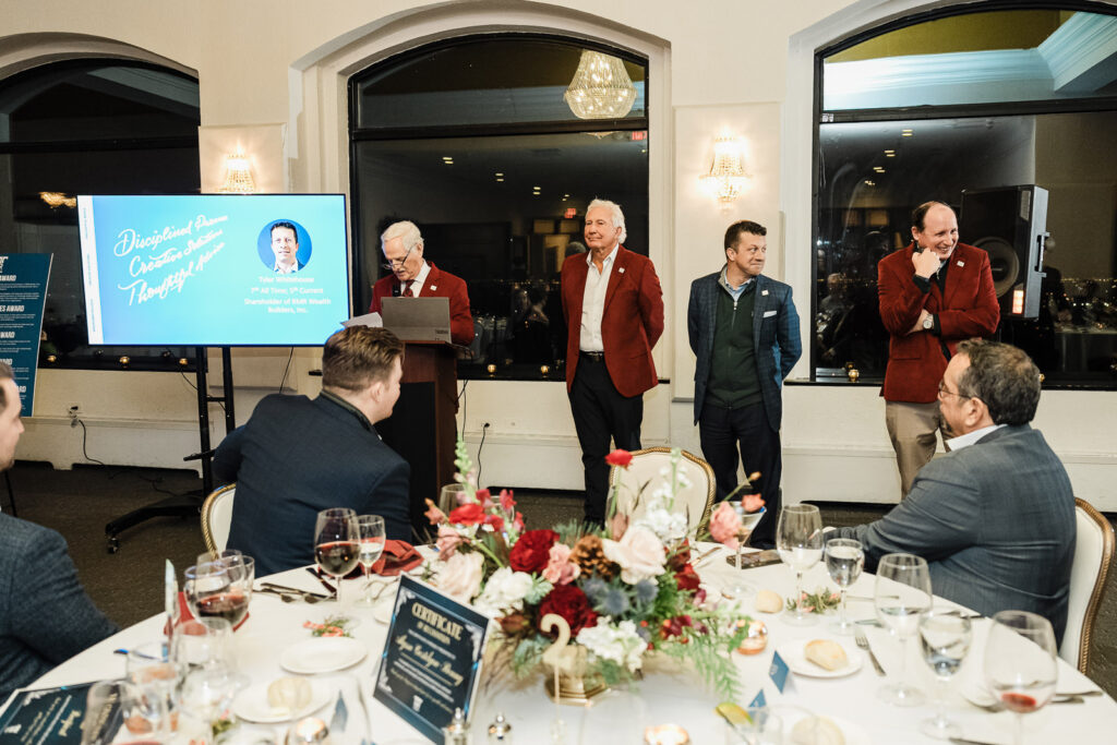 Corporate awards ceremony presentation at The High Lawn with leadership team photographed by Alex Kaplan