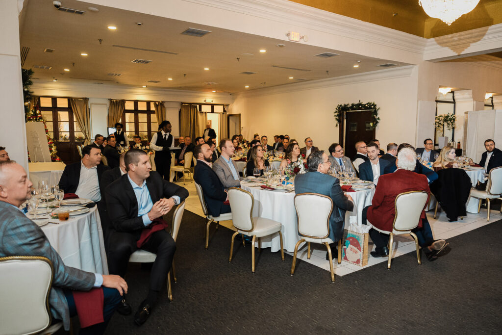 Wide angle view of corporate awards dinner at The High Lawn photographed by Alex Kaplan