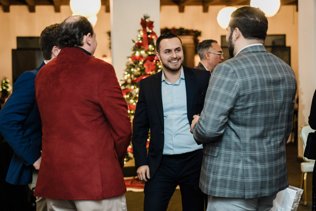 Business professionals networking during cocktail hour at corporate awards dinner photographed by Alex Kaplan Photography