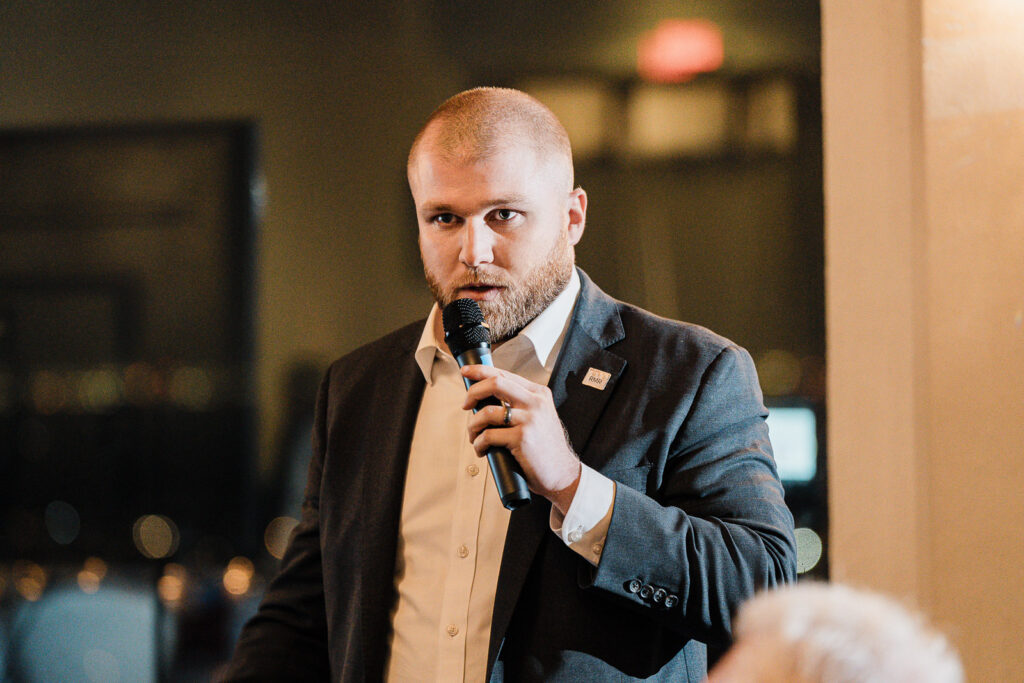 Corporate executive speaking during awards ceremony captured by Alex Kaplan Photography Northern New Jersey