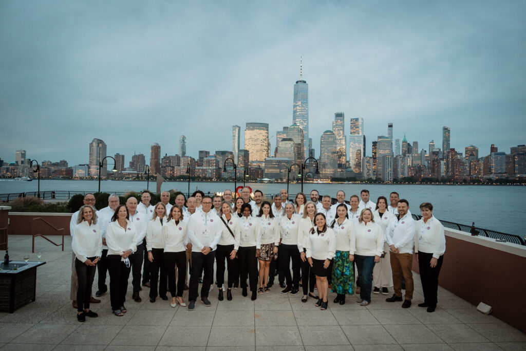 Embecta group photo with Manhattan city lights by Alex Kaplan Photography