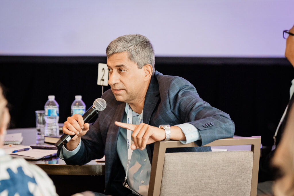 Embecta panel speakers on stage by Alex Kaplan Photography