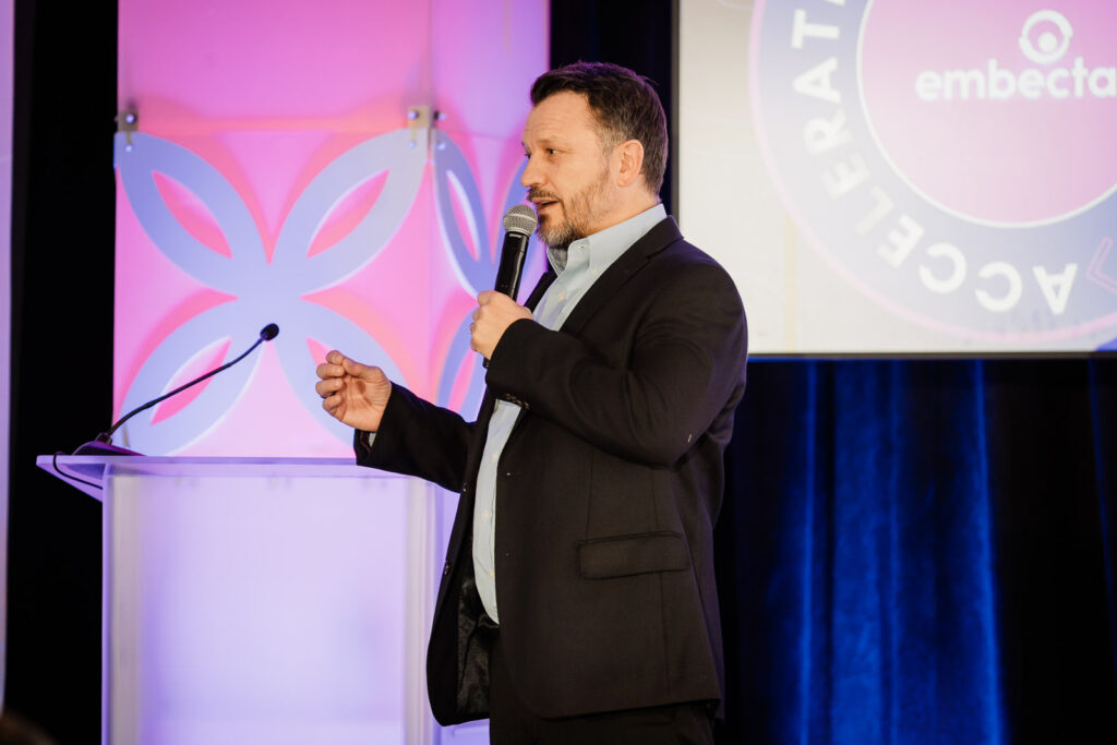 Embecta presenter on branded conference stage by Alex Kaplan Photography