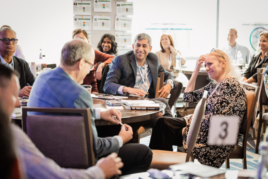 Embecta team engaged in conference session by Alex Kaplan Photography