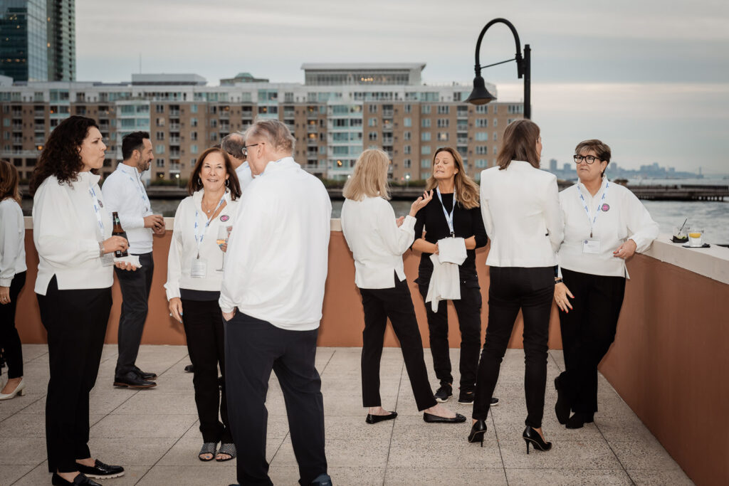 Embecta team networking on Jersey City rooftop by Alex Kaplan Photography