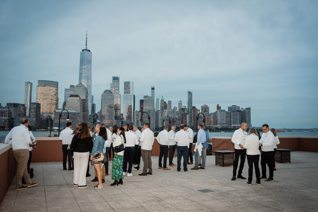 Jersey City corporate event with Manhattan skyline at sunset by Alex Kaplan