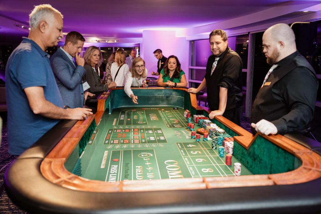 Professionals playing craps at casino night by Alex Kaplan Photography