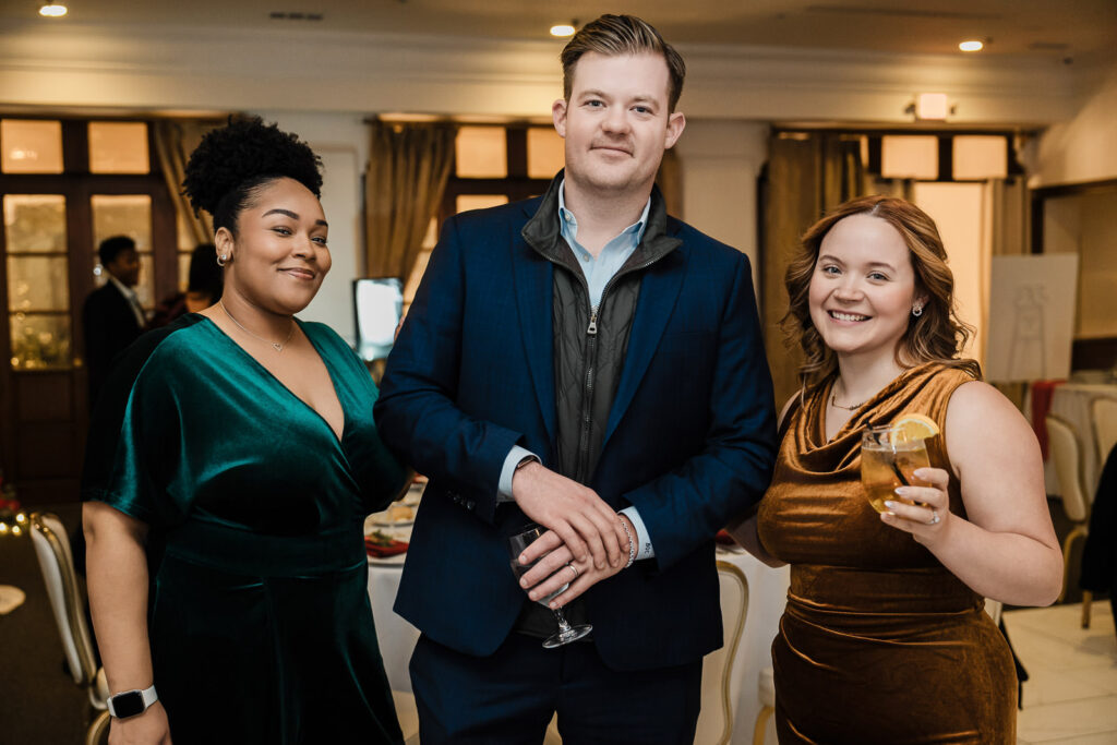 Young professional with senior leader at corporate event captured by Alex Kaplan