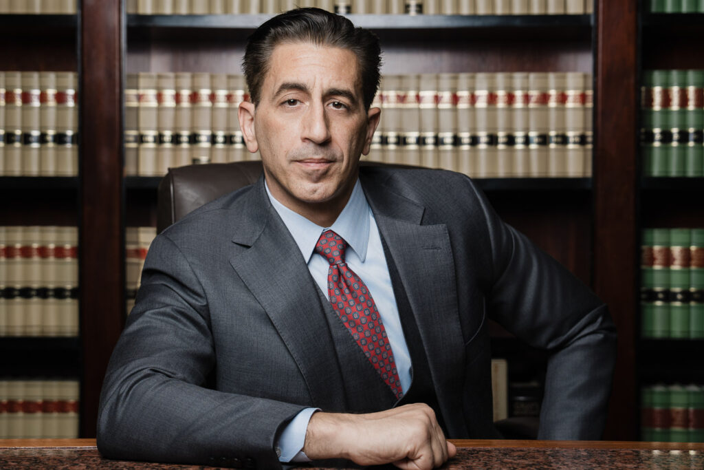 Senior Maggiano Law Firm partner executive headshot with grey background by Alex Kaplan professional photographer Northern NJ