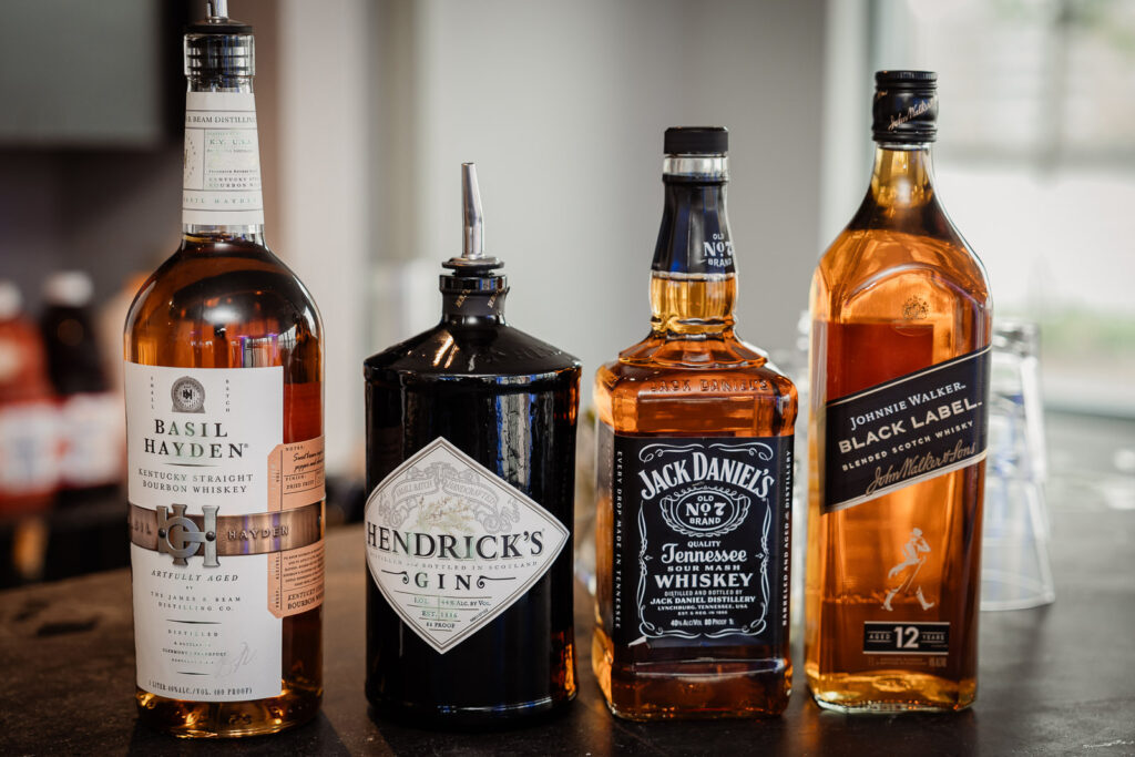 Premium bar setup with top-shelf spirits photographed by Alex Kaplan