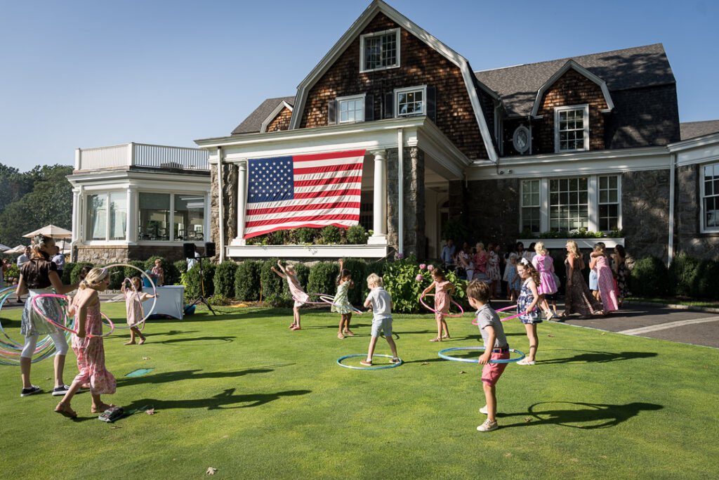 American flag displayed on The Apawamis Club clubhouse during Labor Day BBQ photographed by Alex Kaplan