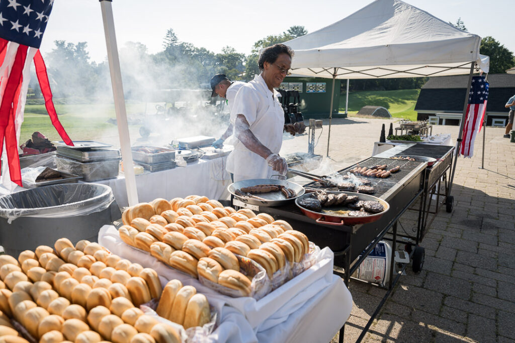 Children playing with hula hoops on the lawn at The Apawamis Club Labor Day BBQ photographed by Alex Kaplan